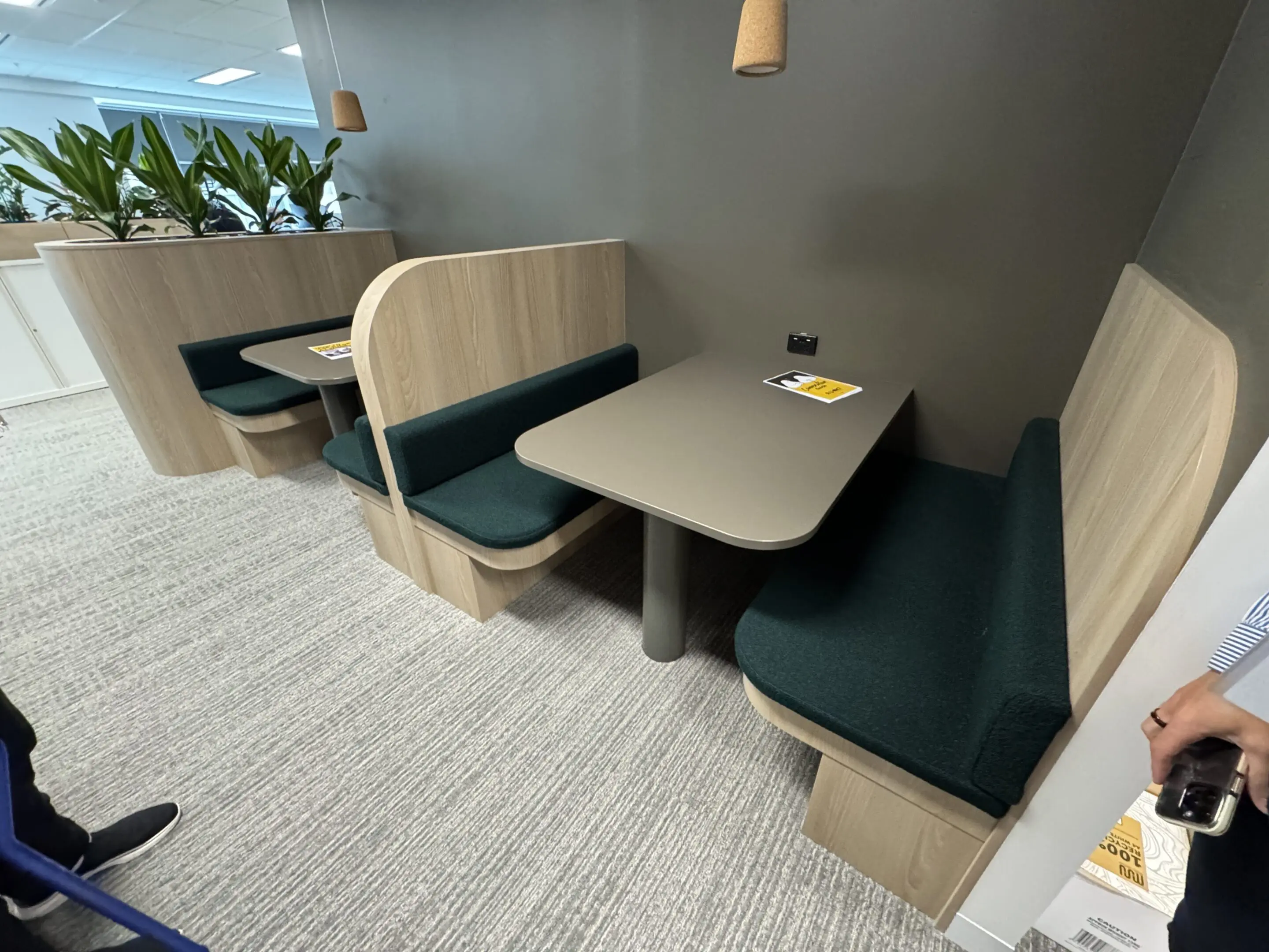 A booth with two booths and a table in the middle.